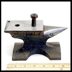 Small railroad rail anvil for making Horseshoe Nail Rings