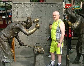 Phillip with Blacksmith Statue in Dujiangyan China