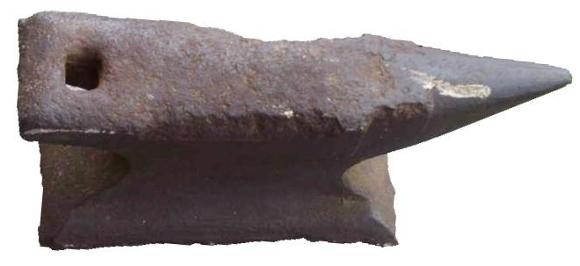 Worn out cast iron anvil.