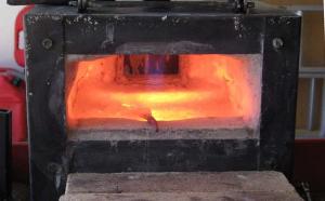 Firing the rebuilt forge.