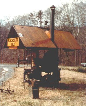 Portable Blacksmith Shop.  Image from old color print.