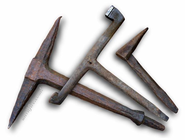 Group of antique T-stakes and a tunnel stake