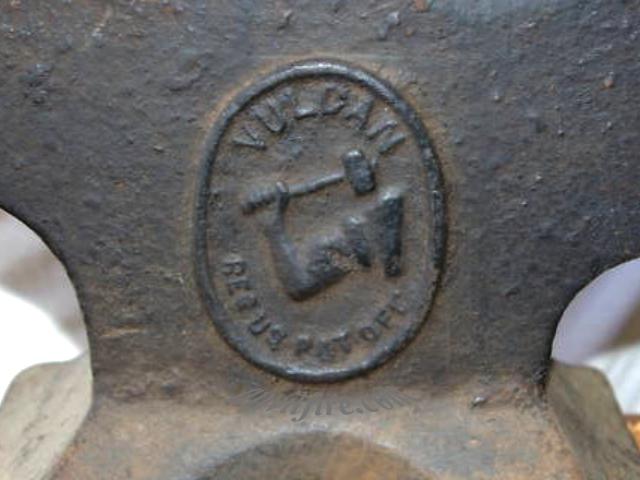 Vulcan arm and hammer logo