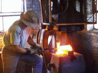 Forging billet on 300 pound Bradley Compact power hammer. Photo by Jock Dempsey