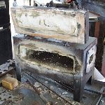 Zinc oxide coated forge interior from burning zinc