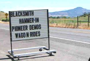 Hammer-In Sign with mountain backdrop